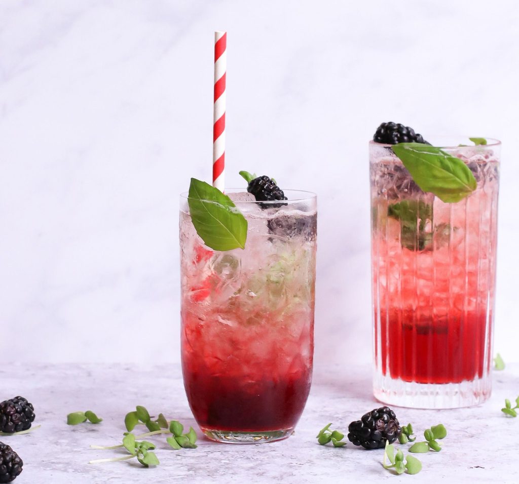 A glass of blackberry passionfruit lemonade