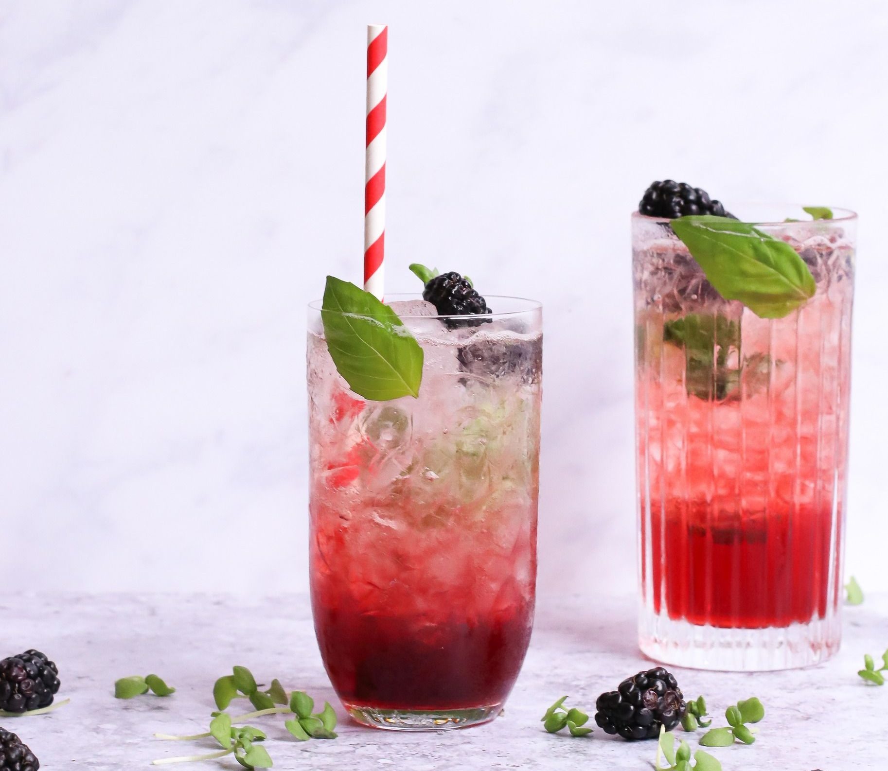 A glass of blackberry passionfruit lemonade