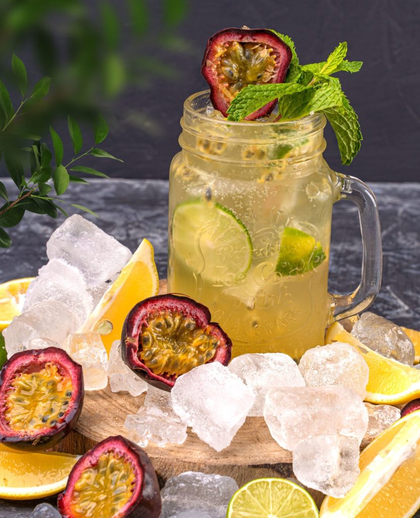 A glass of Passionfruit lemonade with ice