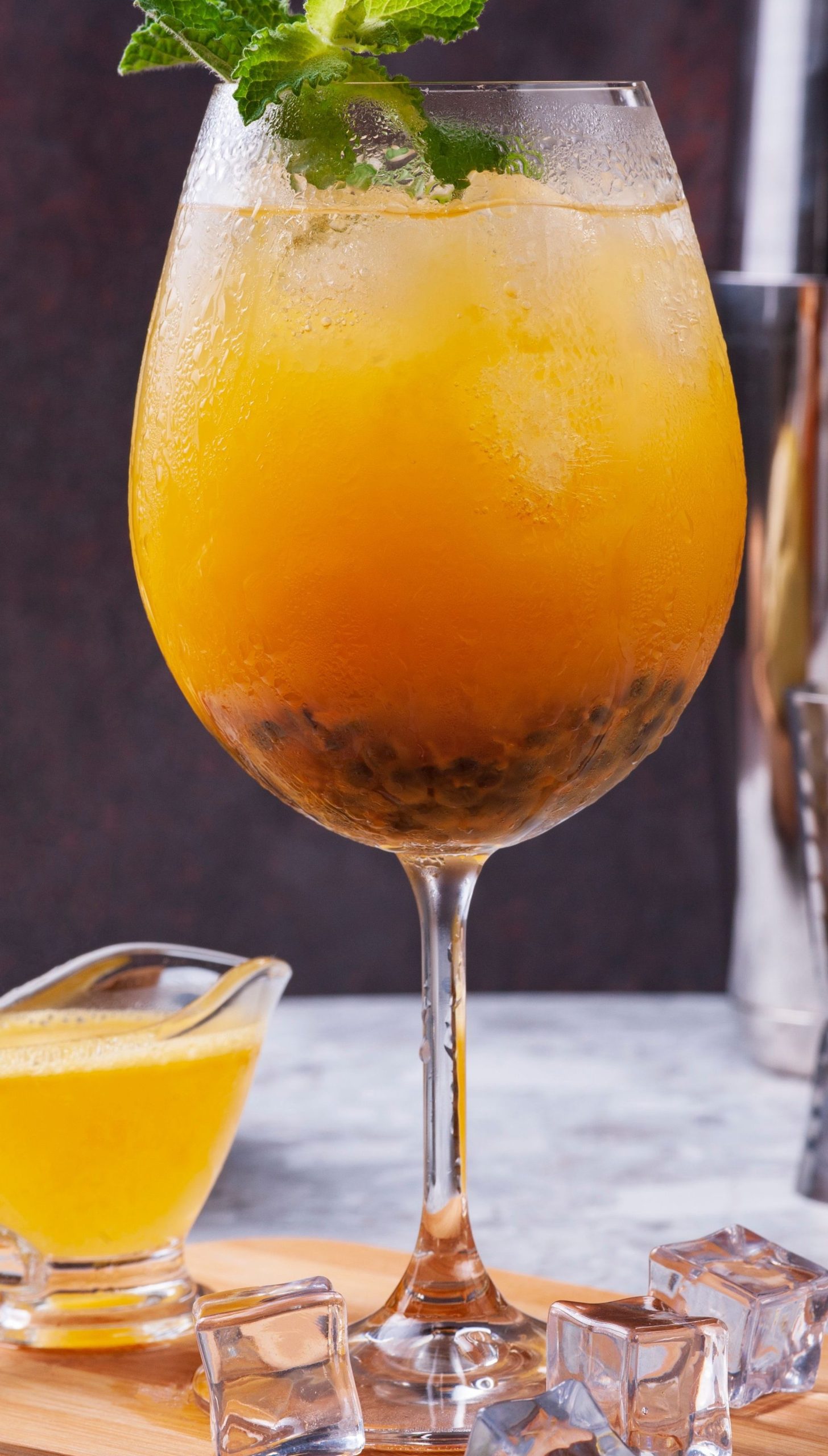 A glass of mango and passionfruit drink