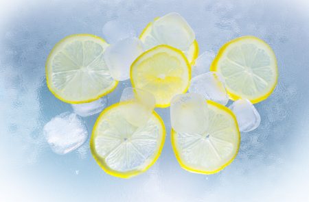 Lemon sliced on ice water.